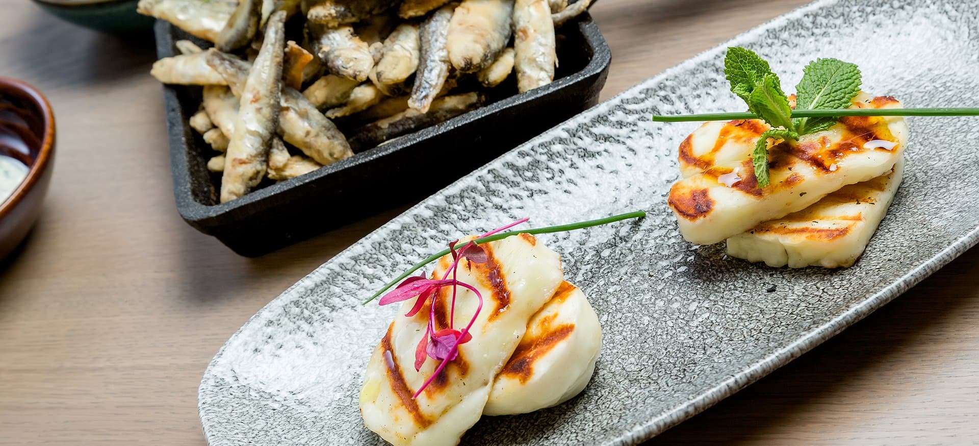 Charcoal grilled goat's cheese, whitebait fried hard and fast.